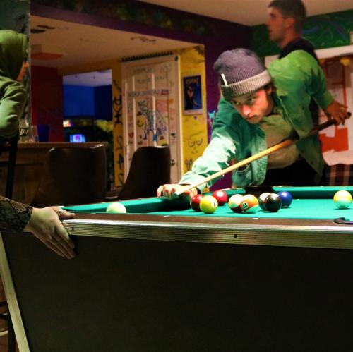 Students playing billiards at C-Haus.